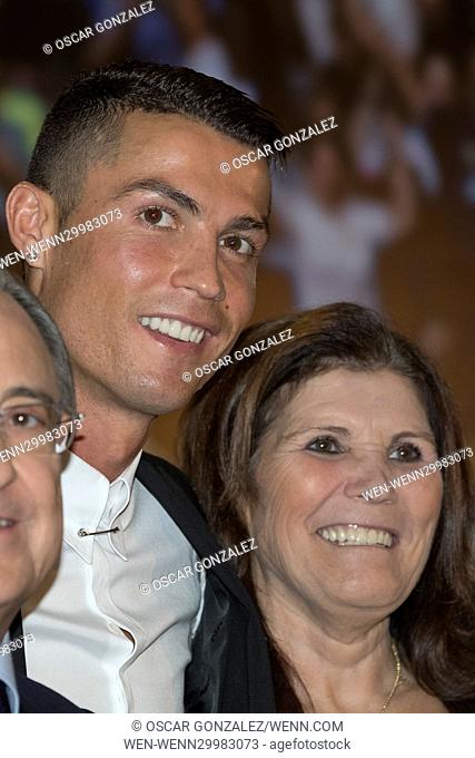 Real Madrid's Portuguese football player Cristiano Ronaldo and his mother Maria Dolores dos Santos Aveiro with club president Florentino Perez during the...