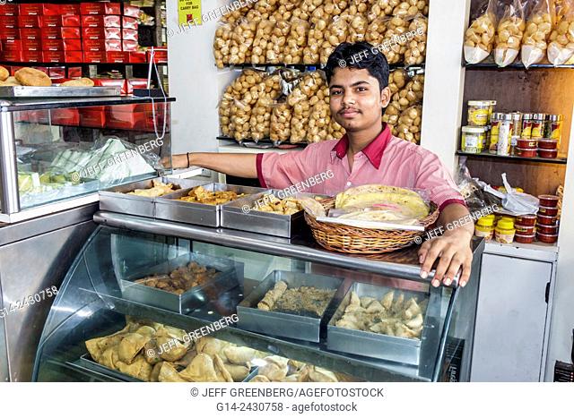 India, Asian, Mumbai, Apollo Bandar, Colaba, Causeway, Market, Shahid Bhagat Singh Marg, food, sale, display case, man, pastries, job, employee