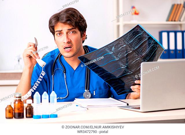 Doctor in telemedicine concept with phone