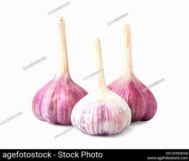 Three garlic heads isolated on a white background