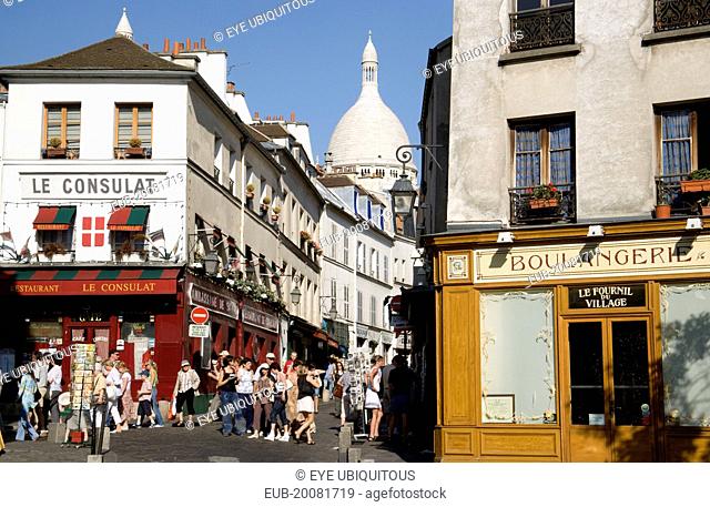 Montmartre Tourists in the narrow streets by the Restaurant Le Consulat near the Church of Sacre Coeur