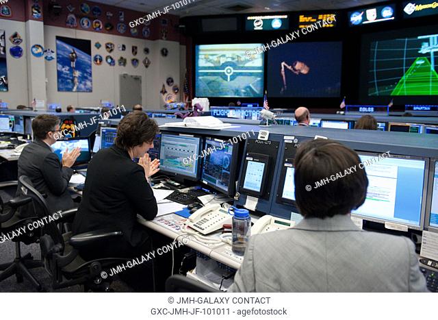 Flight directors Courtenay McMillan (left) and Holly Ridings (center); along with NASA astronaut Megan McArthur, spacecraft communicator (CAPCOM)