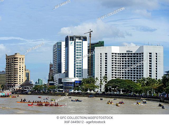 Kuching Waterfront with Hilton Hotel during Sarawak Regatta, on the Sarawak river, Kuching, Sarawak, Borneo, Malaysia