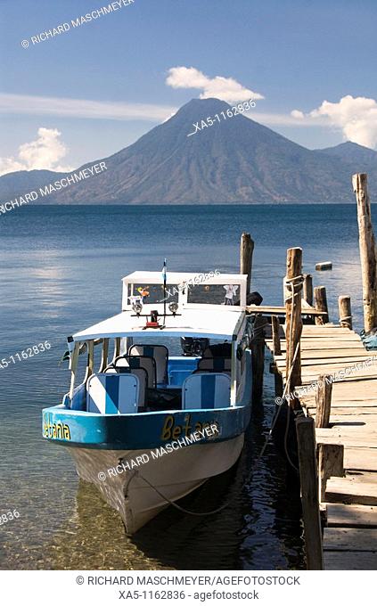 Tour boats near the village of Panajachel and San Pedro Volcano in background, Lake Atitlan, Guatemala