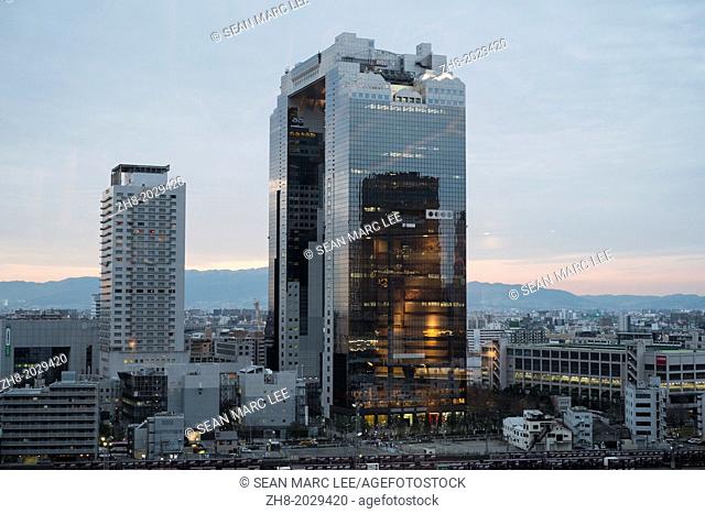 An evening view of the Umeda Sky Building, designed by Hiroshi Hara in Osaka, Japan