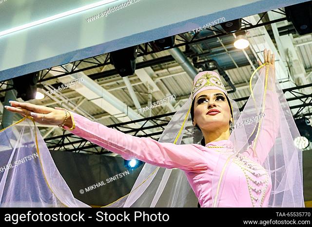 RUSSIA, MOSCOW - DECEMBER 7, 2023: A member of a dancing group performs during a traditional Ossetian wedding held as part of North Ossetia – Alania Republic...
