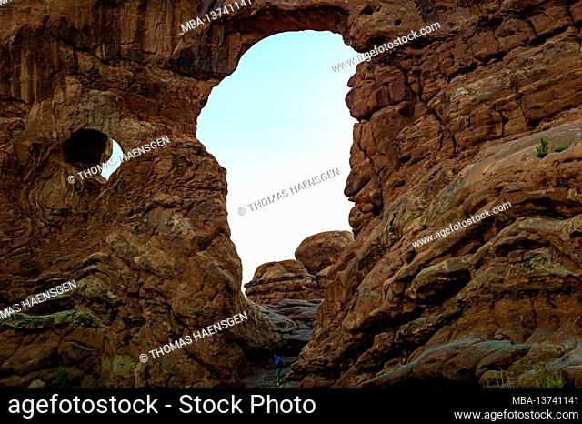 Turret Arch - a sandstone fin featuring large & small openings & a taller, turret-like rock pillar to the side. Arches National Park, near Moab in Utah, USA
