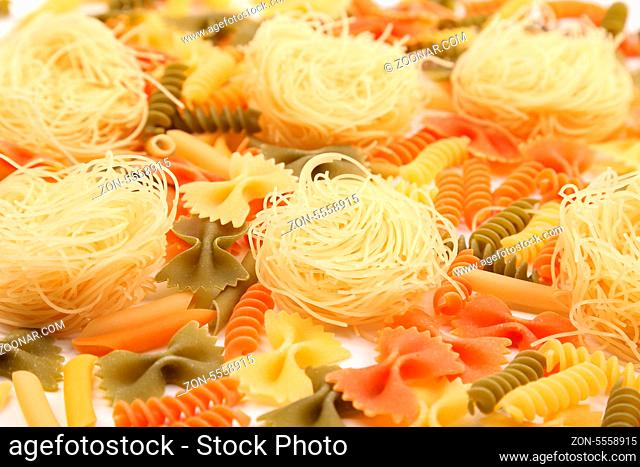 A different pasta in three colors close-up on the white background