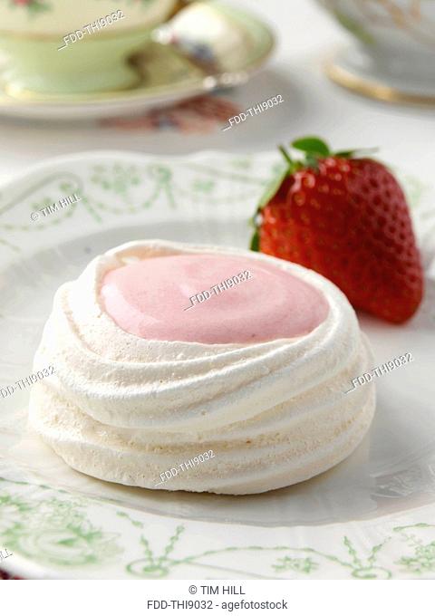 Meringue nest filled with strawberry mousse petites fours