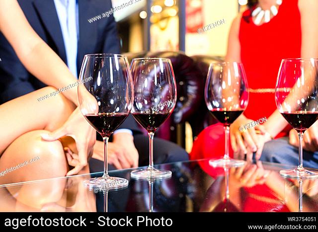 Wine glasses on table in a bar