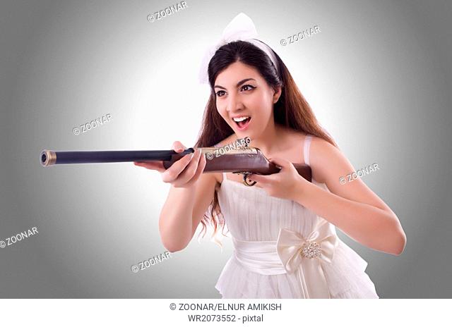 Bride with rifle isolated on white
