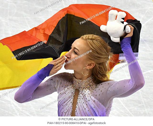 Aljona Savchenko and Bruno Massot from Germany celebrating with a German flag after the award ceremony of the figure skating free skate event of the 2018 Winter...