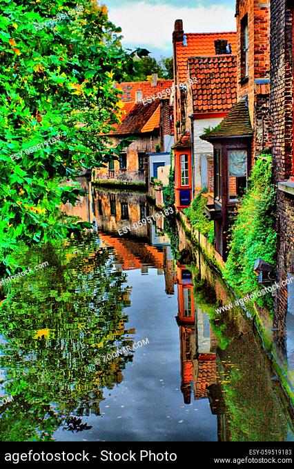 Old brick house in the center of Bruges, near the river