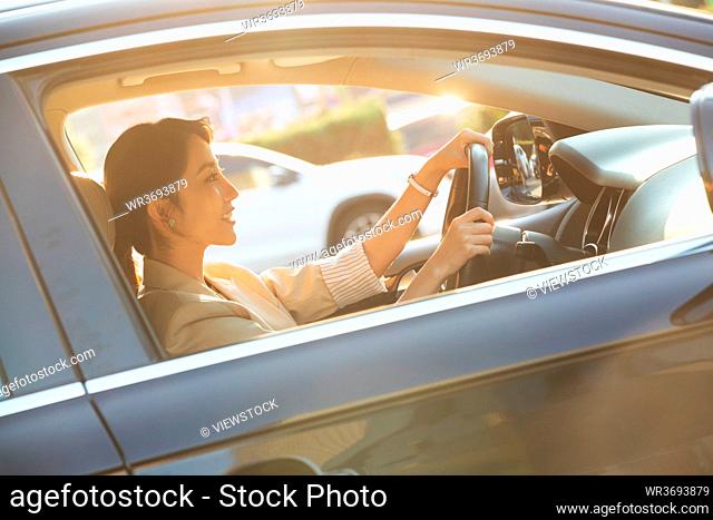 The young woman driving