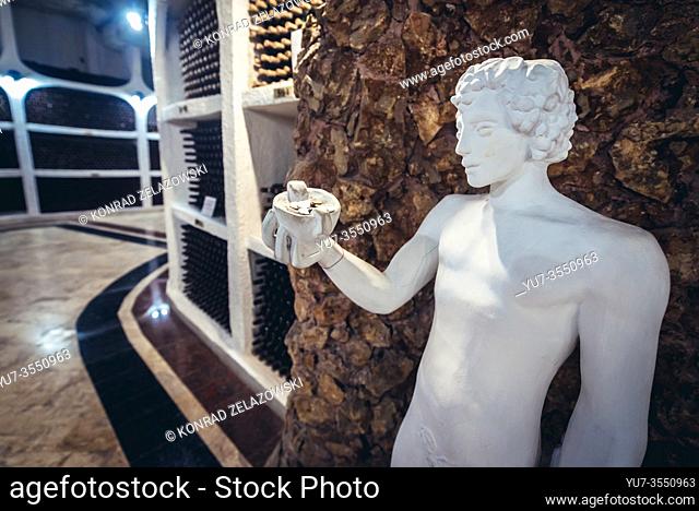 Statue in National Oenotheque - wine collection in Famous Cricova winery in Cricova town near Chisinau, capital of Moldova