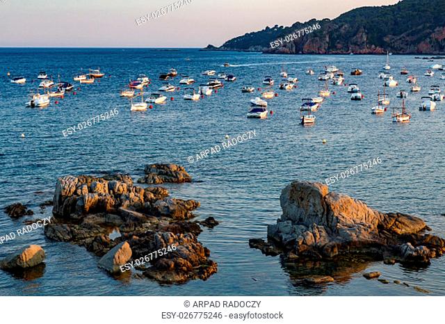 Boats in the ocean near de Tamariu (small village in Costa Brava, Catalonia, Spain)