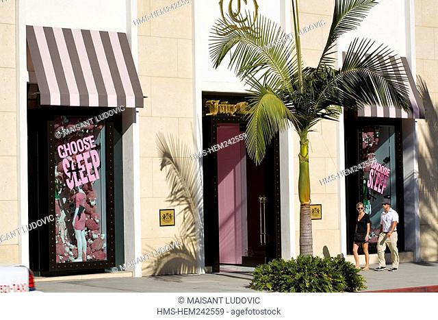 United States, California, Los Angeles, Beverly Hills, Rodeo Drive, couple in front of Juicy Couture store