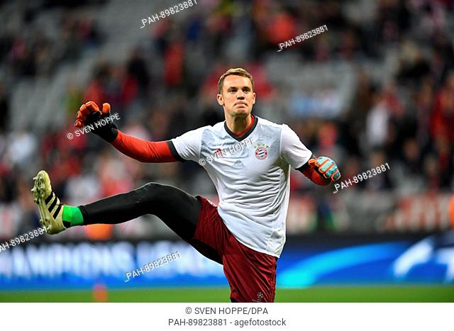Bayern's goalkeeper Manuel Neuer warms up ahead of the first leg of the Champions League quarter final match between Bayern Munich and Real Madrid in the...