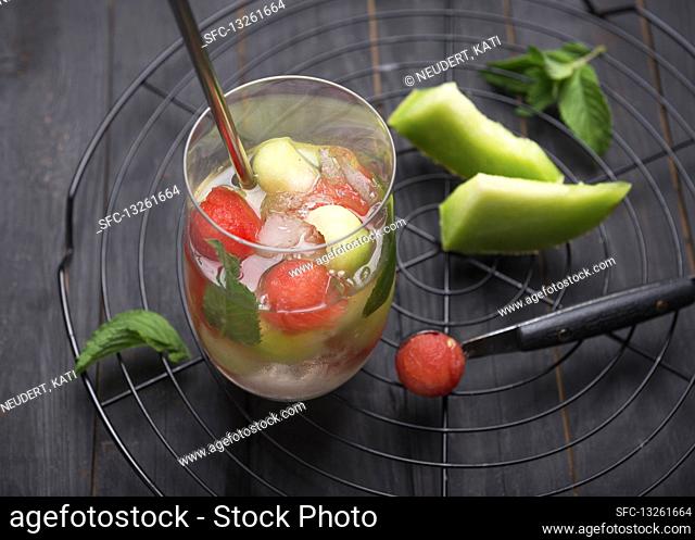 Fizzy white wine Sangria with watermelon and melon balls