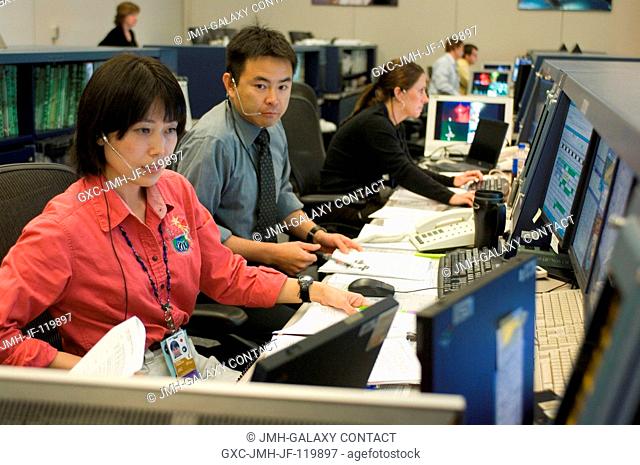 Japan Aerospace Exploration Agency (JAXA) astronauts Naoko Yamazaki (foreground) and Akihiko Hoshide, both spacecraft communicators (CAPCOM)