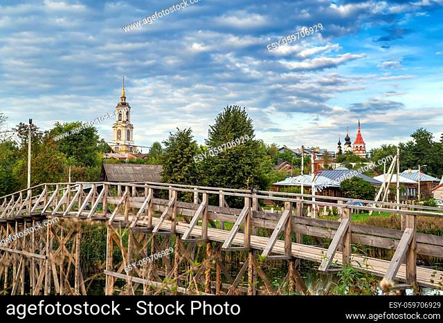 Wooden bridge and cityscape in Suzdal, Russia