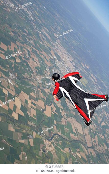 Skydiver wearing wingsuit in the air
