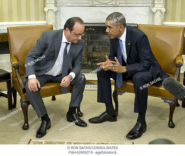 United States President Barack Obama hosts President François Hollande (L) of France for a bilateral meeting in the Oval Office of the White House in Washington