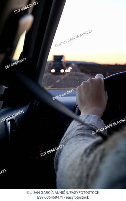 Driver sitting in the car with safety-belt on