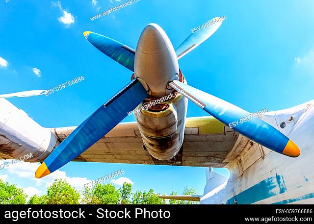Turbine of old soviet turboprop aircraft against the blue sky