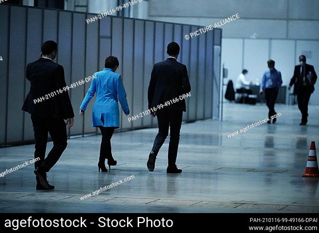 16 January 2021, Berlin: Outgoing CDU Chair Annegret Kramp-Karrenbauer (2nd from left) walks through the hall at the CDU's digital federal party conference