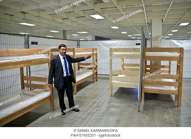 Thomas Vogtherr of the Middle Franconia regional government stands in a former furniture store re-used as a refugee accomodation in Fuerth (Bavaria), Germany