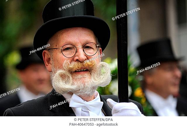 A participant in the Schuetzen parade sports an extraordinary beard as he marche through downtown Hanover, Germany, 30 June 2013