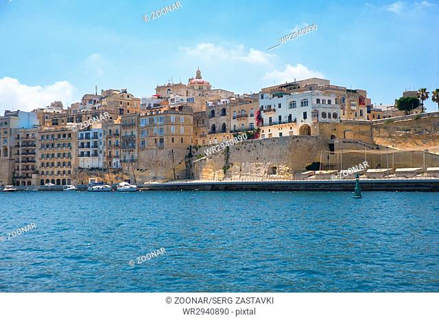The view of Senglea residential houses from the water of Dahla tad-Dockyard bay. Malta