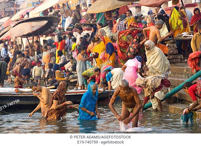 Pilgrims bathing in holy river Ganges, Varanasi, India