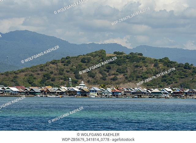 View of Bungin Island, off the coast of Sumbawa Island, Indonesia, home to a group of Bajau Sea Gypsies, famous for living in stilt houses above the water and...