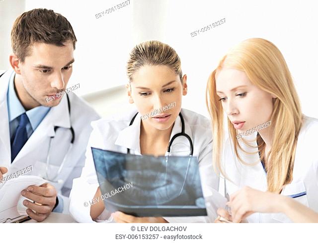 picture of young group of doctors looking at x-ray