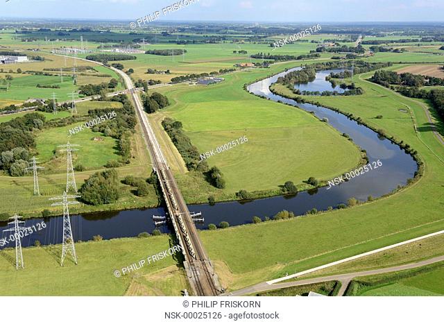 The Overijsselsche Vecht is a rainwater river flowing from Germany into the province of Overijssel in The Netherlands, here with the railway bridge between...
