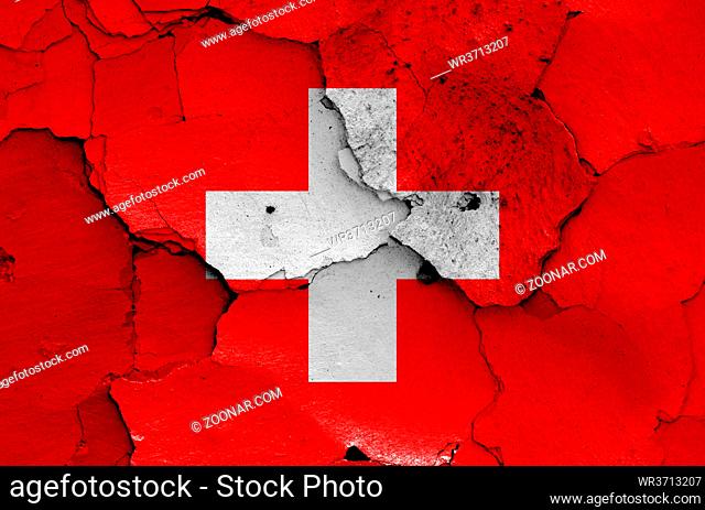 flag of Switzerland painted on cracked wall
