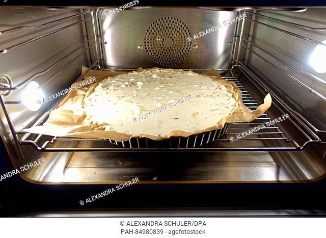 The uncooked dough of an onion cake is placed into the oven in Oberkirch, Germany, 13 October 2016. The savoury cake is mostly eaten in southern Germany