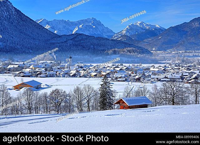 View over the village against mount Zugspitze and Kramerspitz, Ohlstadt, The Blue Land, Upper Bavaria, Bavaria, Germany