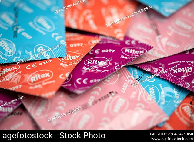 25 March 2020, North Rhine-Westphalia, Bielefeld: Packaged condoms from the German manufacturer Ritex are lying in a pile