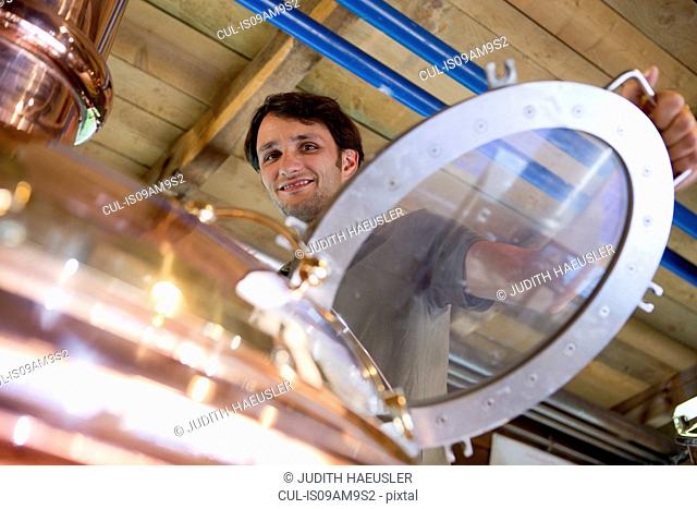 Male brewer working in brewhouse