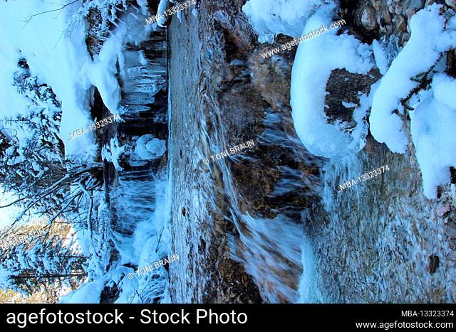 Winter hike to Elmau. romantic brook, Ferchenbach is looking for its way in a snowy winter landscape. Current, Europe, Germany, Bavaria, Upper Bavaria