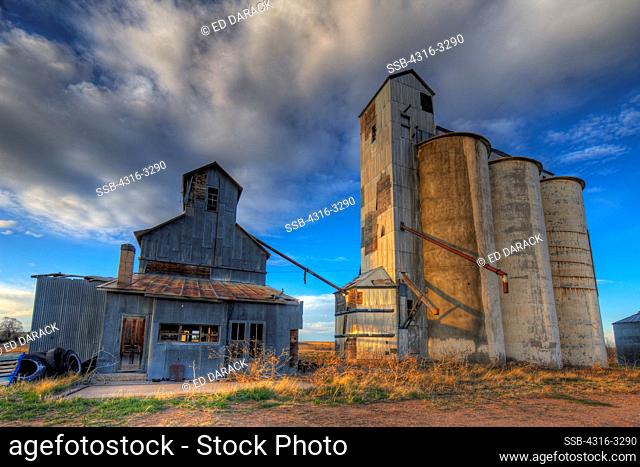 Abandoned grain elevator and grain silos at the ghost town of Willard, in Colorado's eastern plains, in a High Dynamic Range, or HDR view