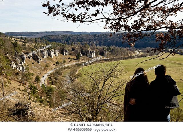 Strollers enjoy a view of the so-called 'Twelve Apostle' rock formation at Altmuehltal nature park near Solnhofen, Germany, 8 March 2015