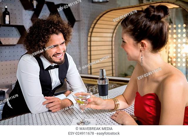 Waiter interacting with beautiful woman