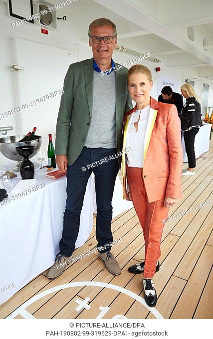 02 August 2019, Hamburg: Günther Jauch, TV presenter, and Cornelia Poletto, top chef, will be standing on the luxury ship MS Europa during the gourmet event...