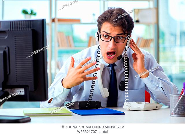 Unhappy angry call center worker frustrated with workload