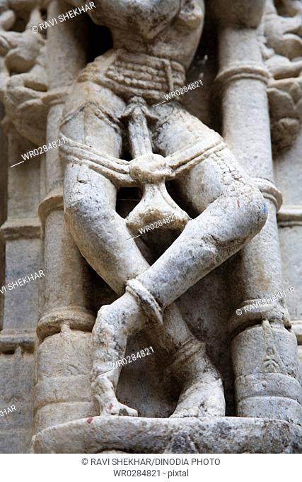 Statue of female dancing legs posture in Adinath jain temple heritage , Village Dilwara , Udaipur , Rajasthan , India