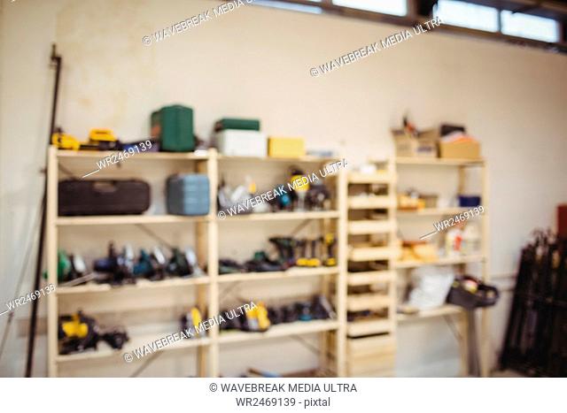 Photograph of a shelf with working tools in a workshop